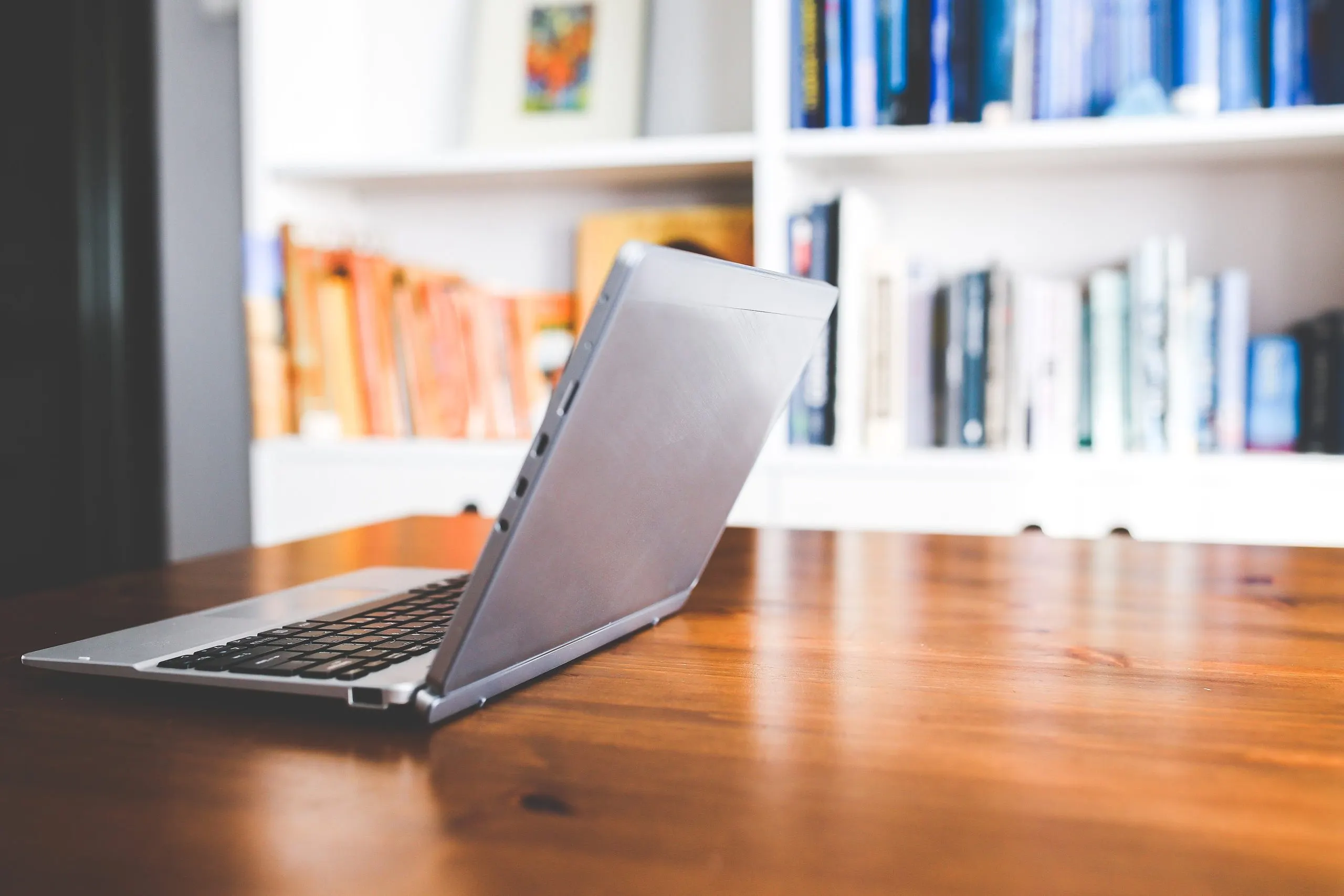 A laptop open on an office desk